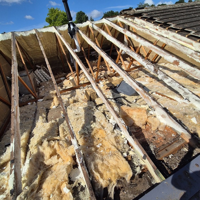 Old roof felt being stripped off
